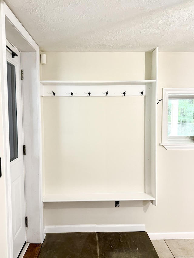 3951 S St, Coventry, CT 06238 - mudroom featuring a textured ceiling and baseboards