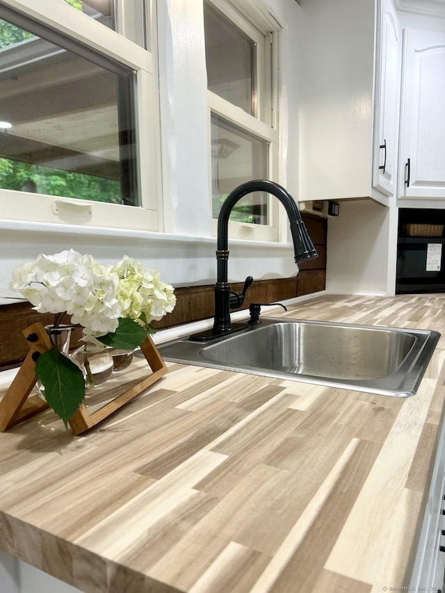 3951 S St, Coventry, CT 06238 - detailed view of a sink and white cabinetry