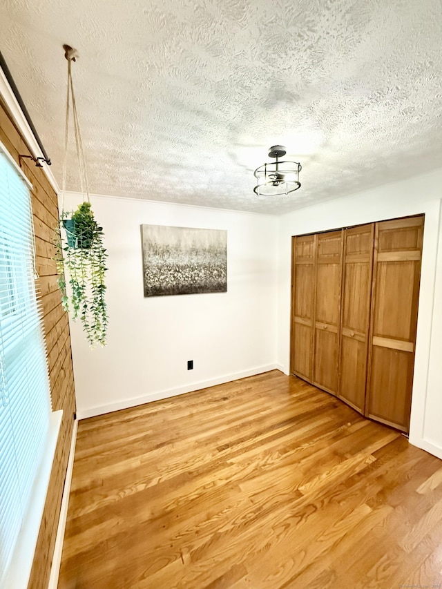 3951 S St, Coventry, CT 06238 - unfurnished bedroom with a textured ceiling, light wood-type flooring, and a closet