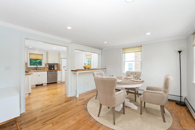 10 Sable St, Norwalk, CT 06854 - dining space featuring crown molding, light wood-type flooring, recessed lighting, and a baseboard heating unit