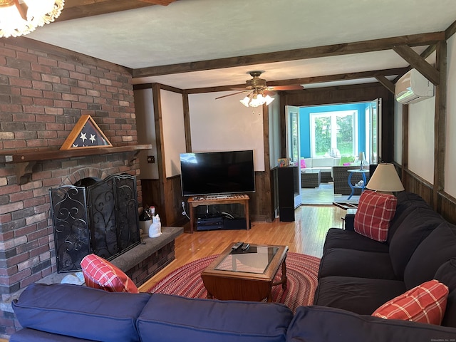 25 Tanglewood Ln, Naugatuck, CT 06770 - living area featuring a wall mounted air conditioner, wood finished floors, wooden walls, beamed ceiling, and ceiling fan