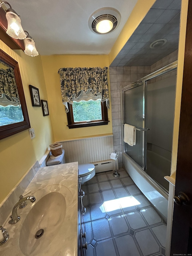 25 Tanglewood Ln, Naugatuck, CT 06770 - full bath with vanity, bath / shower combo with glass door, tile patterned floors, and a baseboard radiator