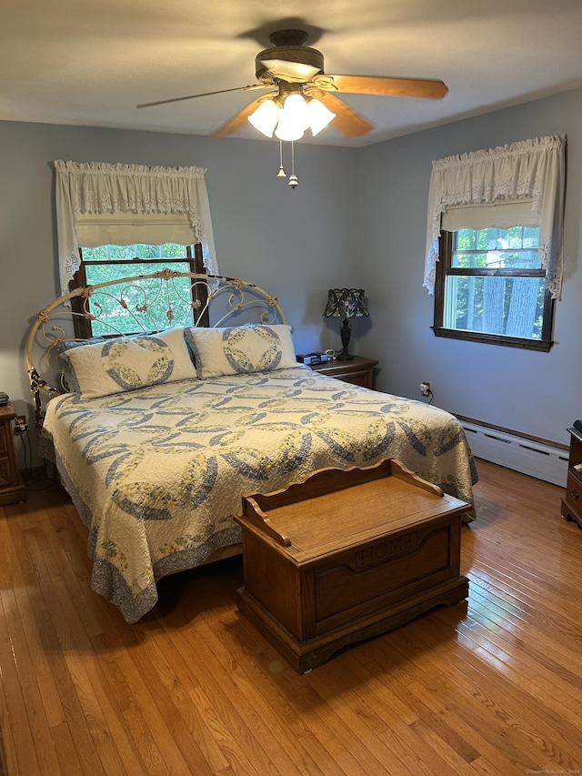 25 Tanglewood Ln, Naugatuck, CT 06770 - bedroom with baseboard heating, multiple windows, and wood-type flooring