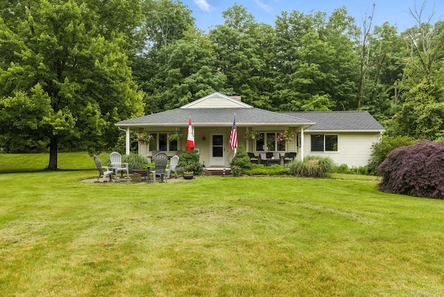 480 Wall St, Hebron, CT 06248 - view of front of property featuring covered porch, a front yard, roof with shingles, and an outdoor fire pit