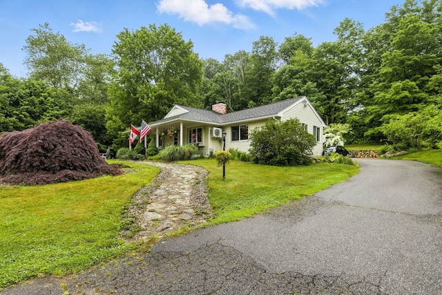 480 Wall St, Hebron, CT 06248 - view of front of home with a chimney, a front lawn, and a porch