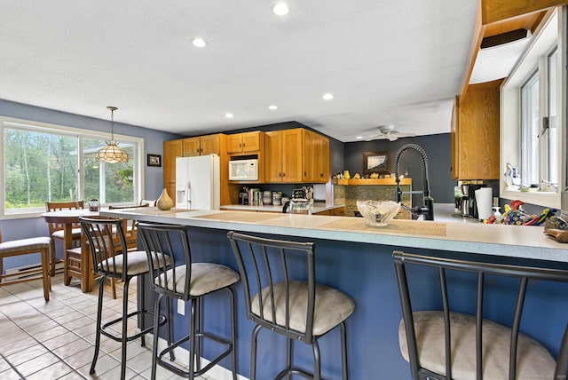 480 Wall St, Hebron, CT 06248 - kitchen featuring white appliances, recessed lighting, a peninsula, and light countertops