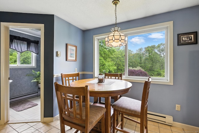 480 Wall St, Hebron, CT 06248 - dining area featuring a baseboard radiator, a baseboard heating unit, light tile patterned floors, and a textured ceiling