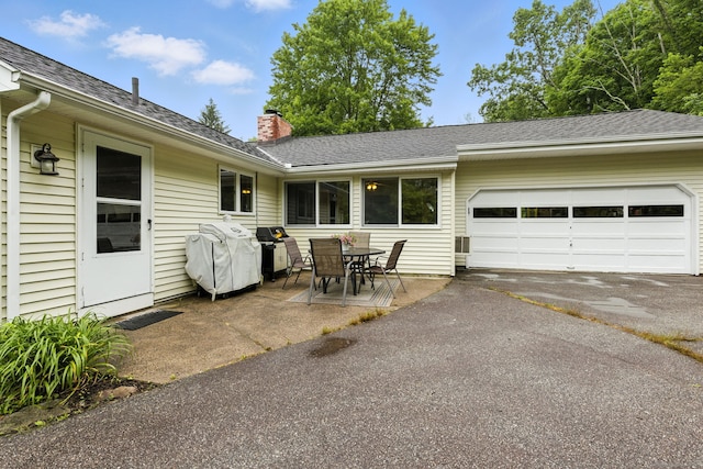 480 Wall St, Hebron, CT 06248 - view of patio with driveway, an attached garage, and area for grilling