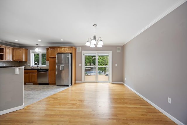 123 Sperry Ln, Meriden, CT 06451 - kitchen featuring appliances with stainless steel finishes, crown molding, a chandelier, dark countertops, and open shelves