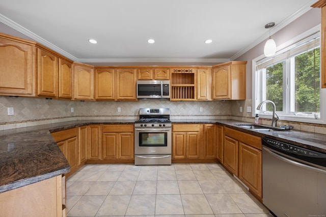 123 Sperry Ln, Meriden, CT 06451 - kitchen with stainless steel appliances, ornamental molding, light tile patterned floors, decorative backsplash, and dark stone counters