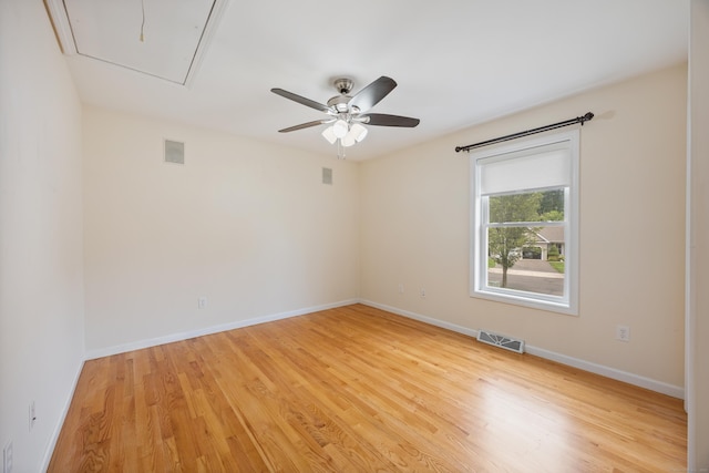 123 Sperry Ln, Meriden, CT 06451 - unfurnished room with attic access, light wood-style floors, and a ceiling fan