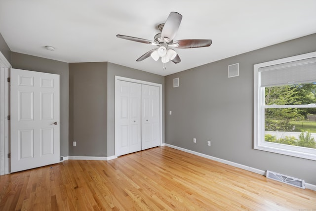 123 Sperry Ln, Meriden, CT 06451 - unfurnished bedroom featuring light wood-style flooring, a closet, and ceiling fan