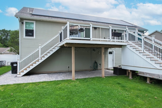 123 Sperry Ln, Meriden, CT 06451 - rear view of property featuring stairs, a lawn, a deck, a patio area, and solar panels