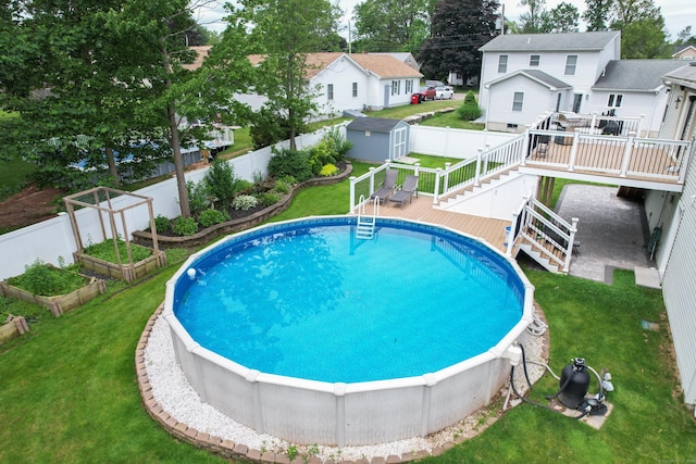 123 Sperry Ln, Meriden, CT 06451 - view of pool featuring a wooden deck, a shed, stairway, a fenced backyard, and a garden