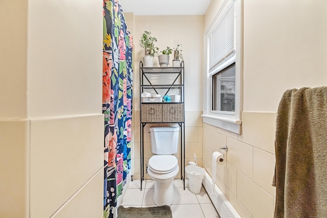 190 Whitney Ave, Bridgeport, CT 06606 - full bath featuring tile patterned flooring, tile walls, curtained shower, and wainscoting