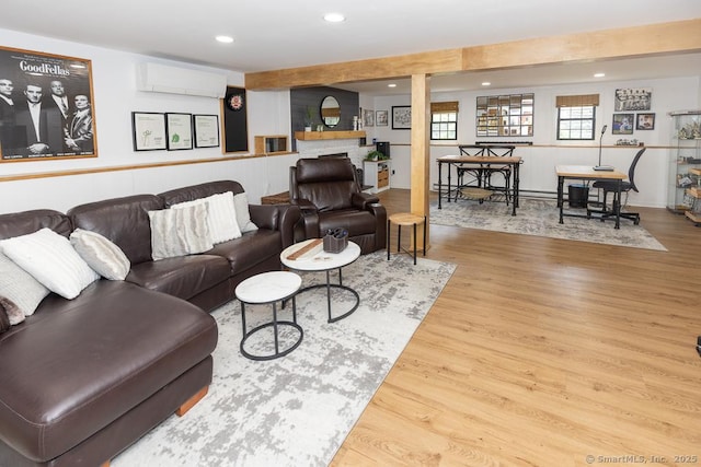 10 Laurel Grove Dr, Haddam, CT 06441 - living room featuring a wall mounted AC, wood finished floors, recessed lighting, a wainscoted wall, and a fireplace