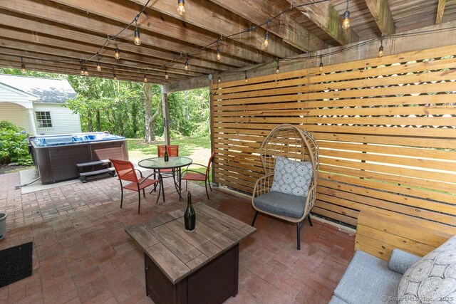10 Laurel Grove Dr, Haddam, CT 06441 - view of patio featuring a hot tub and outdoor dining space