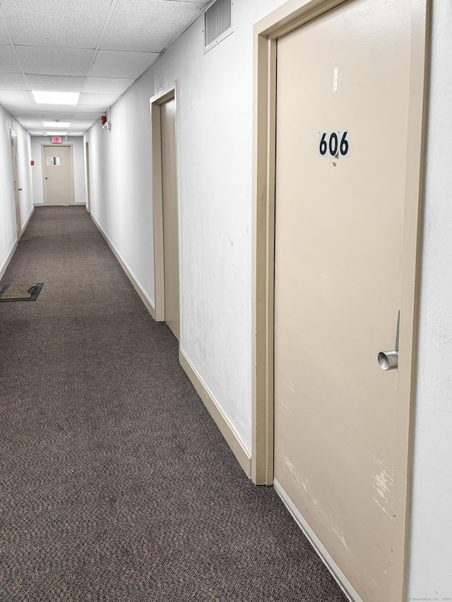 120 Huntington Tpke Unit 606, Bridgeport, CT 06610 - hallway featuring dark colored carpet and a drop ceiling