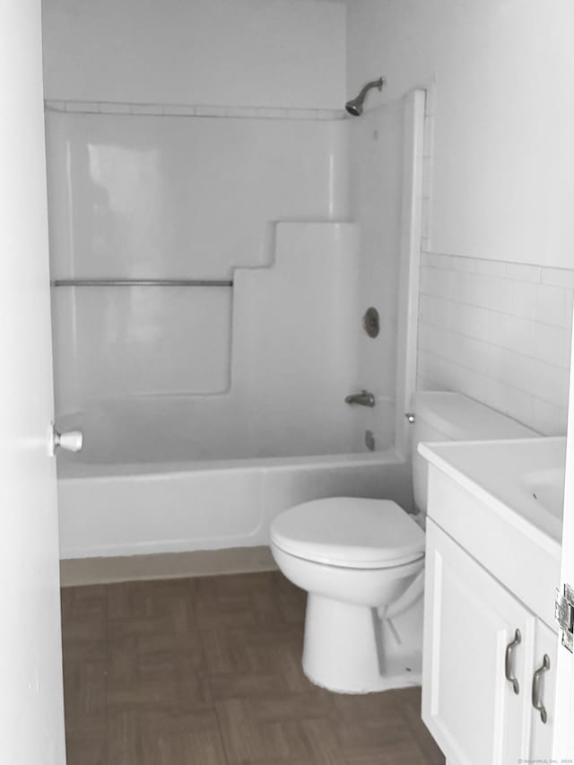 120 Huntington Tpke Unit 606, Bridgeport, CT 06610 - bathroom featuring vanity, washtub / shower combination, and tile walls