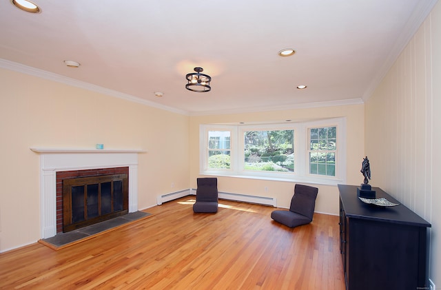 37 Lamplighter Ln, Fairfield, CT 06825 - living area featuring a baseboard heating unit, wood finished floors, ornamental molding, a glass covered fireplace, and recessed lighting