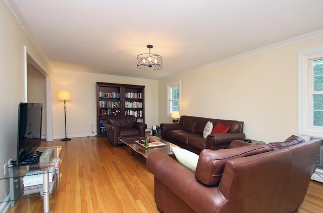 37 Lamplighter Ln, Fairfield, CT 06825 - living area with plenty of natural light, light wood finished floors, crown molding, and a chandelier
