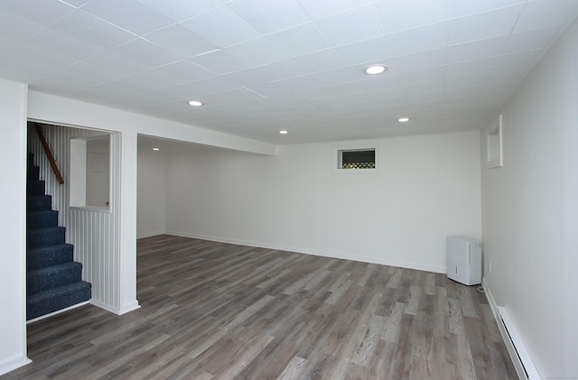 37 Lamplighter Ln, Fairfield, CT 06825 - finished below grade area with wood finished floors, recessed lighting, stairway, and a baseboard radiator