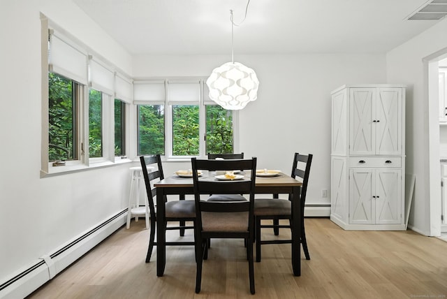 4 Earls Ct Unit 4C, Farmington, CT 06032 - dining room featuring baseboard heating and light wood-style flooring
