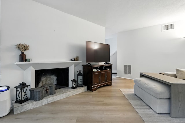 4 Earls Ct Unit 4C, Farmington, CT 06032 - living area with light wood finished floors and a fireplace