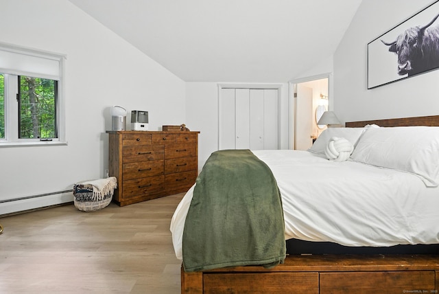 4 Earls Ct Unit 4C, Farmington, CT 06032 - bedroom featuring lofted ceiling, wood finished floors, a baseboard radiator, and a closet