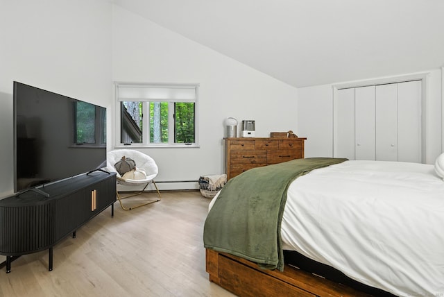 4 Earls Ct Unit 4C, Farmington, CT 06032 - bedroom featuring vaulted ceiling, wood finished floors, baseboard heating, and a closet