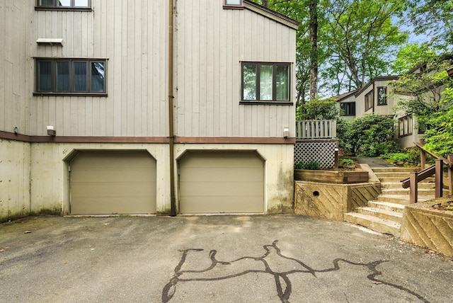 4 Earls Ct Unit 4C, Farmington, CT 06032 - back of property featuring an attached garage and driveway