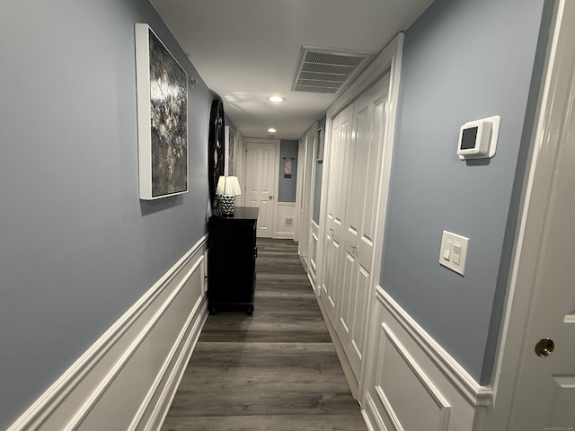 3250 Fairfield Ave Apt 100, Bridgeport, CT 06605 - hall with dark wood-style flooring, recessed lighting, and wainscoting