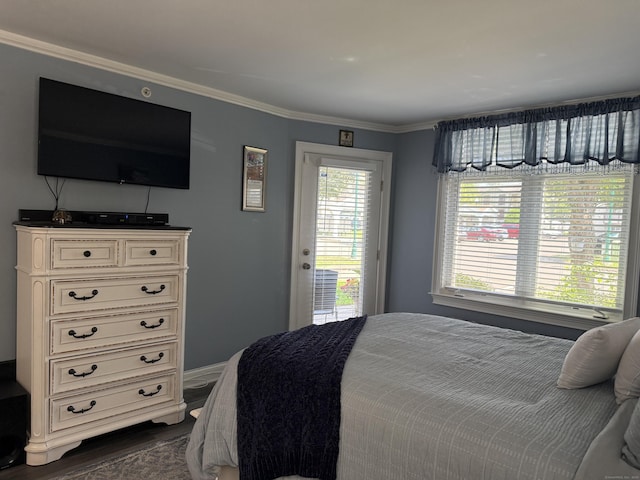 3250 Fairfield Ave Apt 100, Bridgeport, CT 06605 - bedroom featuring access to exterior, ornamental molding, and dark wood finished floors