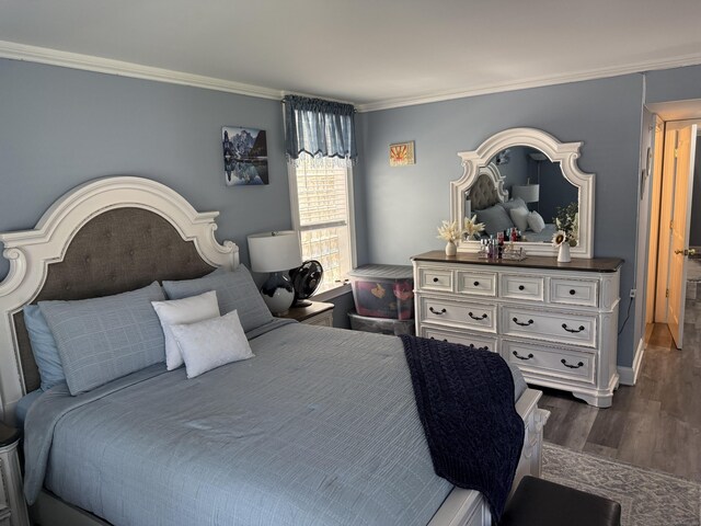 3250 Fairfield Ave Apt 100, Bridgeport, CT 06605 - bedroom with ornamental molding and dark wood-style flooring