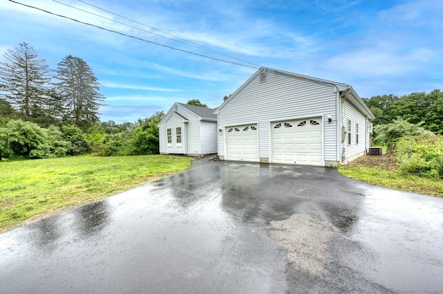 295 Hunting Lodge Rd, Mansfield, CT 06268 - view of home's exterior with driveway, a lawn, and a garage