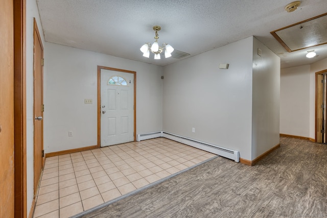 295 Hunting Lodge Rd, Mansfield, CT 06268 - foyer entrance featuring a baseboard heating unit, a textured ceiling, and a chandelier