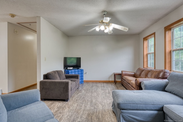 295 Hunting Lodge Rd, Mansfield, CT 06268 - living area with wood finished floors, a textured ceiling, and ceiling fan