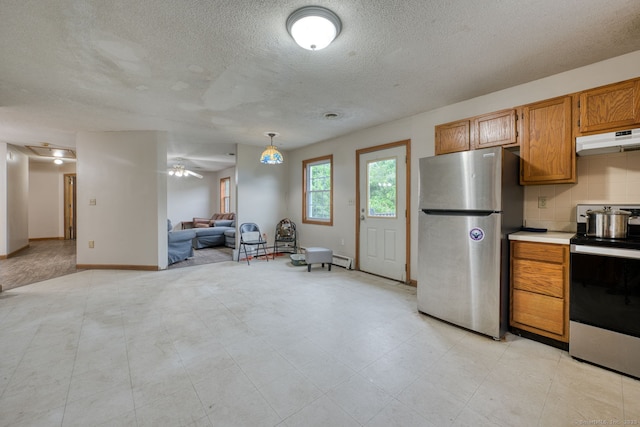 295 Hunting Lodge Rd, Mansfield, CT 06268 - kitchen featuring appliances with stainless steel finishes, under cabinet range hood, a textured ceiling, light countertops, and open floor plan