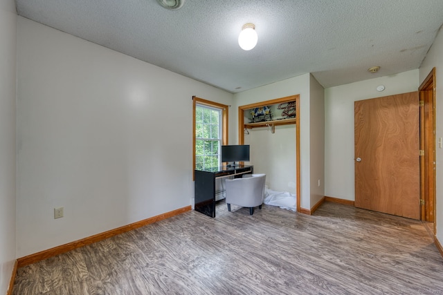 295 Hunting Lodge Rd, Mansfield, CT 06268 - home office featuring wood finished floors and a textured ceiling