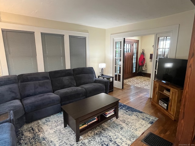 50 Wheeler Ter, Stratford, CT 06614 - living area with wood finished floors and french doors