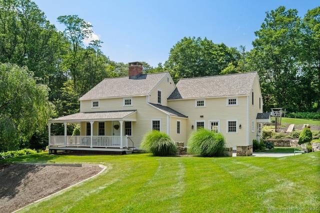 52 Aunt Park Ln, Newtown, CT 06470 - back of house featuring a porch, a chimney, a lawn, and a shingled roof
