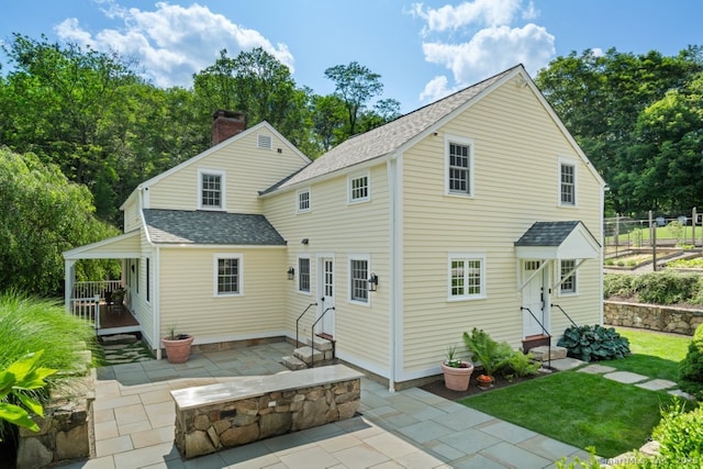 52 Aunt Park Ln, Newtown, CT 06470 - back of house featuring roof with shingles, entry steps, and a patio