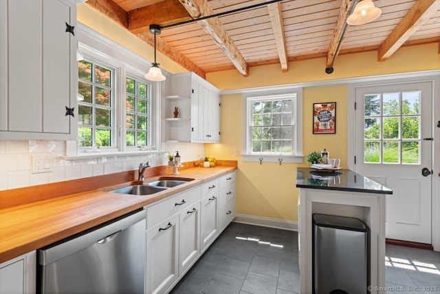 52 Aunt Park Ln, Newtown, CT 06470 - kitchen featuring a wooden ceiling with exposed beams, dishwasher, dark tile patterned floors, decorative backsplash, and wooden counters
