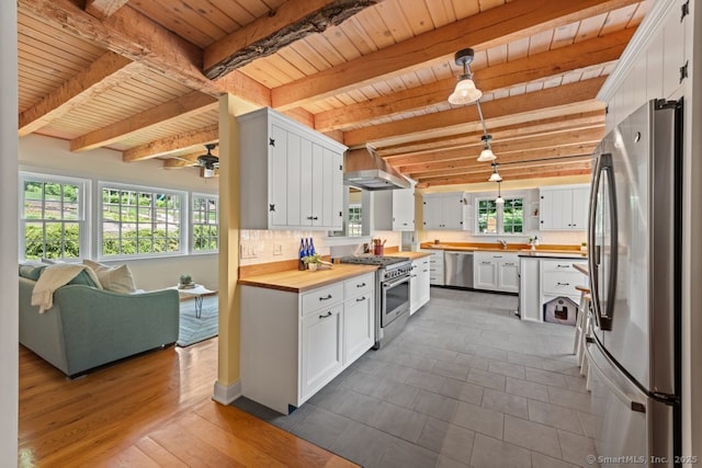 52 Aunt Park Ln, Newtown, CT 06470 - kitchen with appliances with stainless steel finishes, butcher block counters, extractor fan, a wooden ceiling with exposed beams, and open floor plan