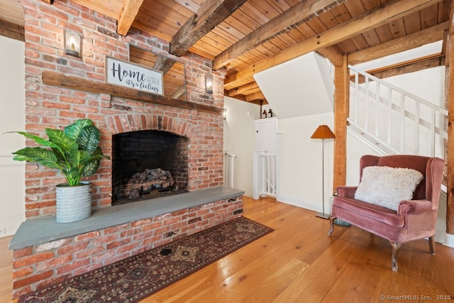 52 Aunt Park Ln, Newtown, CT 06470 - living area with a wood ceiling with exposed beams, hardwood / wood-style flooring, a fireplace, and stairway