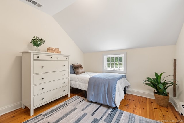 52 Aunt Park Ln, Newtown, CT 06470 - bedroom with light wood finished floors, lofted ceiling, and baseboard heating