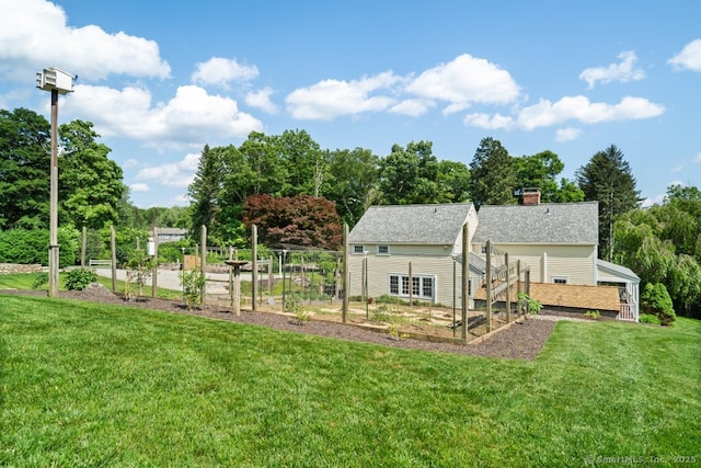 52 Aunt Park Ln, Newtown, CT 06470 - view of grassy yard featuring a garden and view of scattered trees