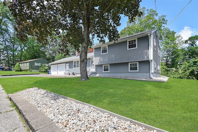 6 Bel Aire Dr, Plainville, CT 06062 - view of front of property featuring a front lawn, a garage, and driveway