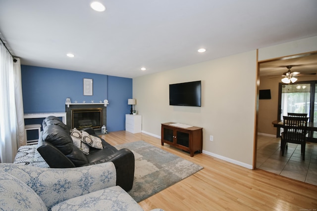 6 Bel Aire Dr, Plainville, CT 06062 - living room featuring wood finished floors, a ceiling fan, recessed lighting, and a glass covered fireplace