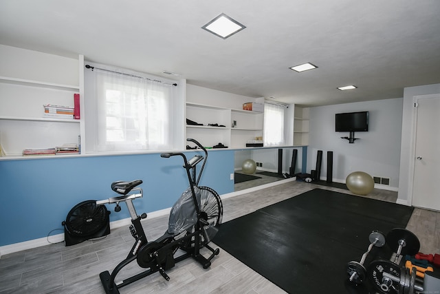 6 Bel Aire Dr, Plainville, CT 06062 - exercise room with wood finished floors and baseboards